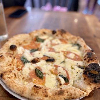Mercurio's signature dishes Pizza RobertoCaprese PaninoHomemade Gelato